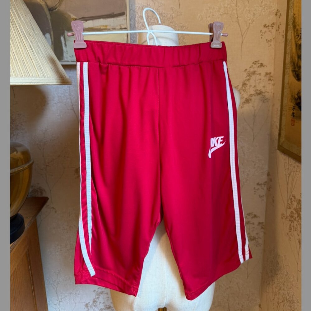 Vintage Nike red Women's  athletic shorts with white side stripes